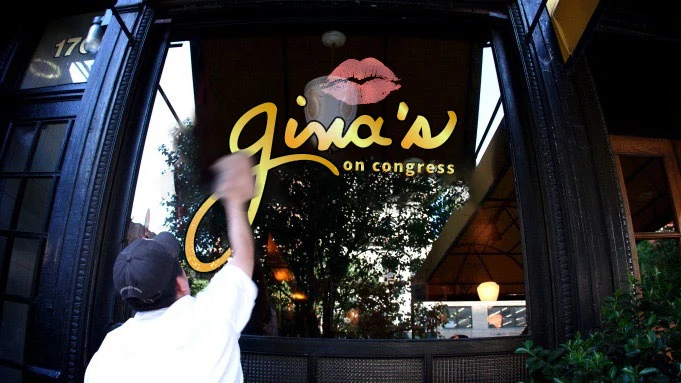 Gina's on Congress signature lettered on the front window